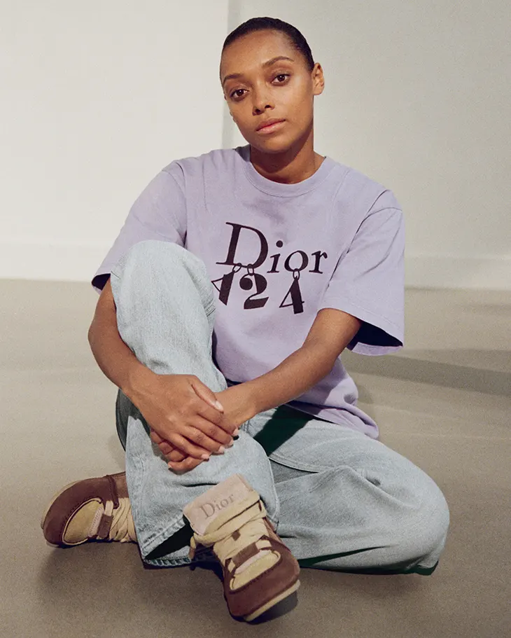 Sophie Wilde seated in a Dior x A24 T-shirt as part of the campaign’s cast of Jonathan Andersons.