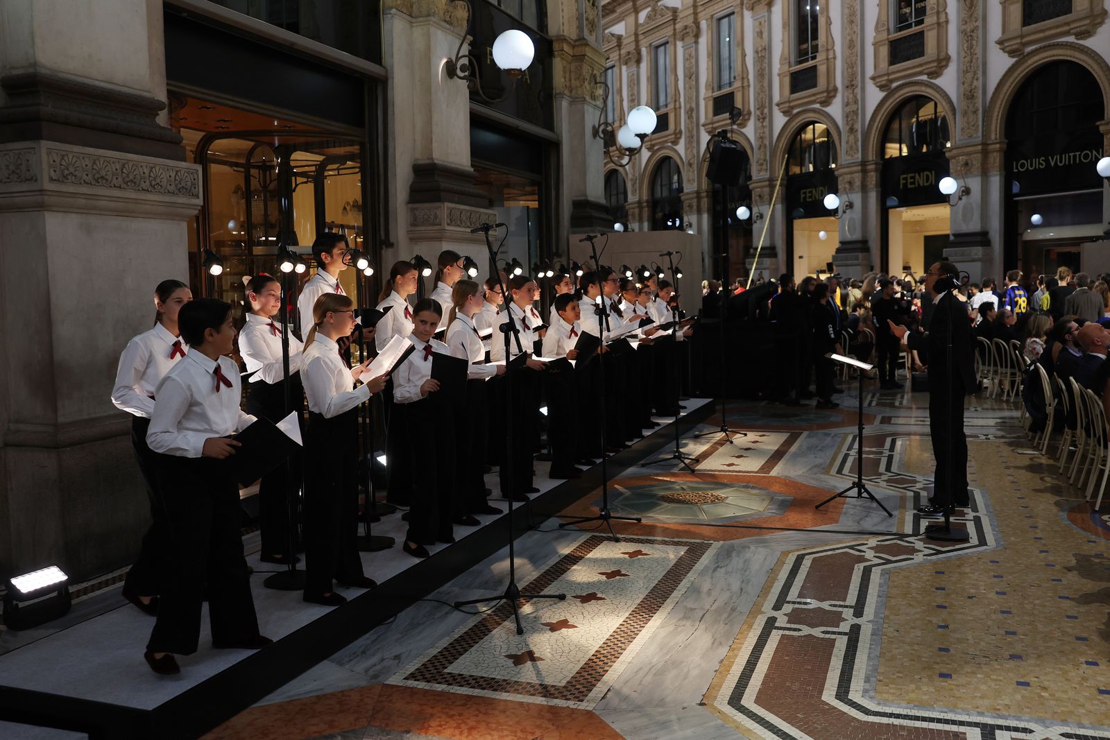 The La Scala Academy choir performing inside the Galleria Vittorio Emanuele II during Vogue World Milano.