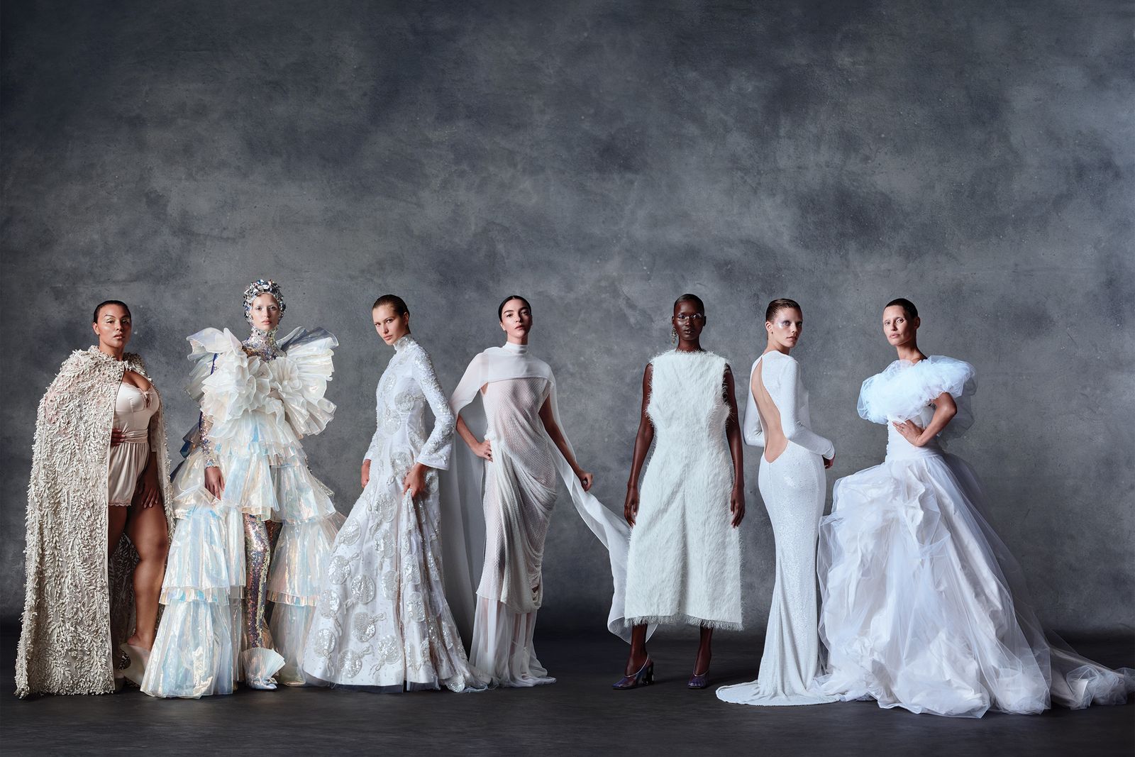 Seven models in sculptural white looks representing Vogue World’s imagination revolution.
