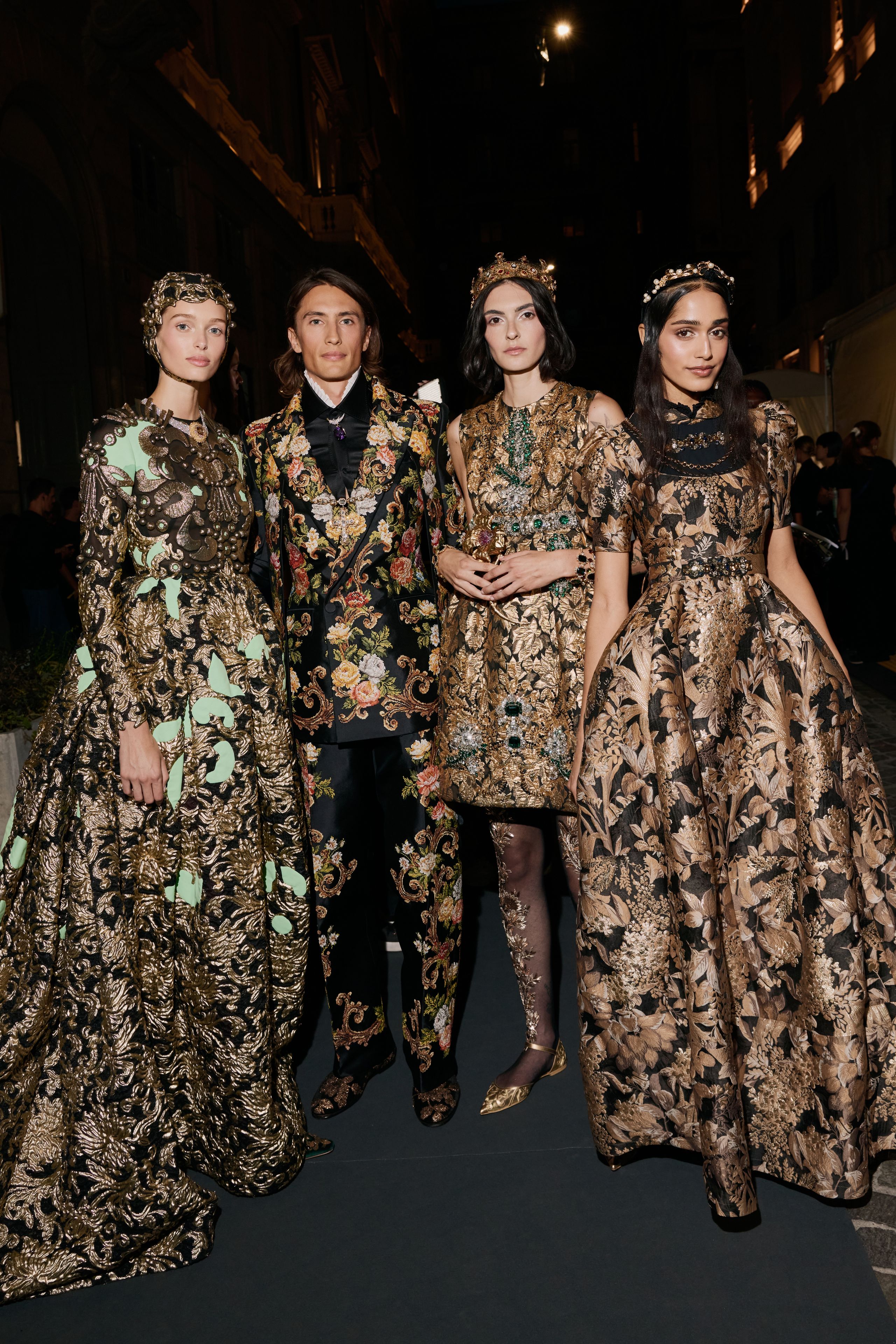 Four performers in richly worked artisanal looks at Vogue World Milano 2026.